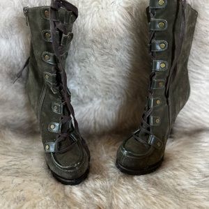 Green Charles David tie up boots with brown leather detail.